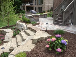 Retaining wall, stone stairs, and hydrangeas